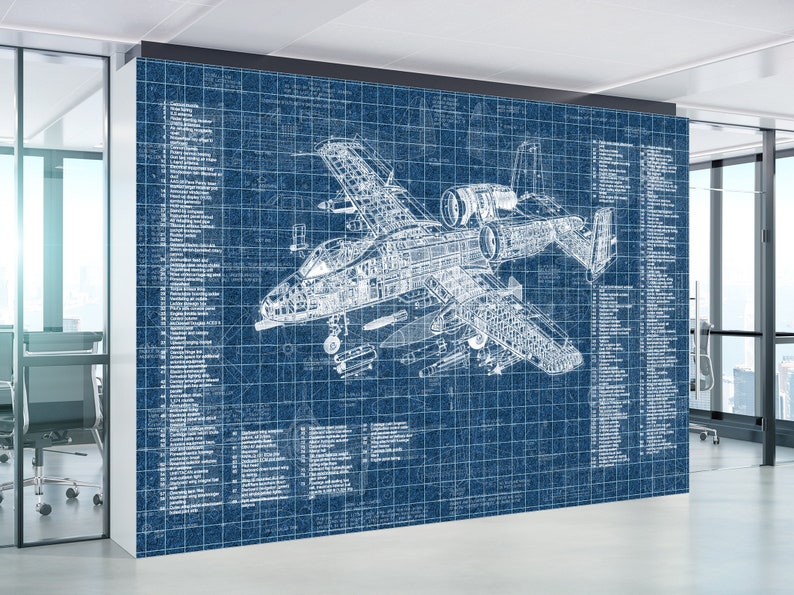 May include: A large wall mural featuring a detailed white technical blueprint of an A-10 Thunderbolt II aircraft on a dark blue background. The design includes intricate mechanical cross-sections, structural components, and numbered lists of parts.