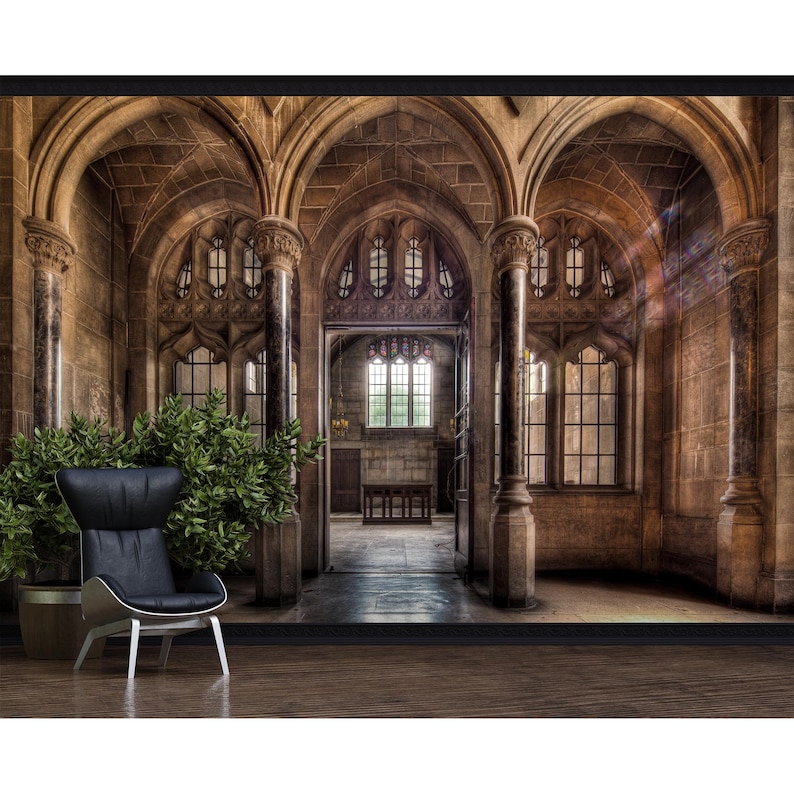May include: A digital print of a gothic cathedral interior with arched ceilings, stone columns, and stained-glass windows. A modern black armchair sits in front of a large potted plant. The scene is bathed in warm light.