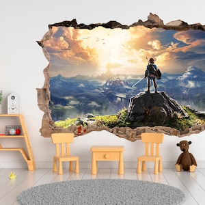 May include: A wall decal featuring a video game character standing on a mountaintop overlooking a vast landscape. The character is wearing a green tunic and holding a sword. The background is a sunset sky with clouds. The decal is designed to look like a hole in the wall, creating a 3D effect.