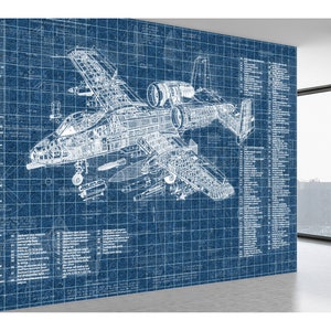 May include: A large wall mural featuring a detailed white technical blueprint of an A-10 Thunderbolt II aircraft on a blue grid background. The design includes extensive technical annotations and numbered labels detailing various aircraft components.
