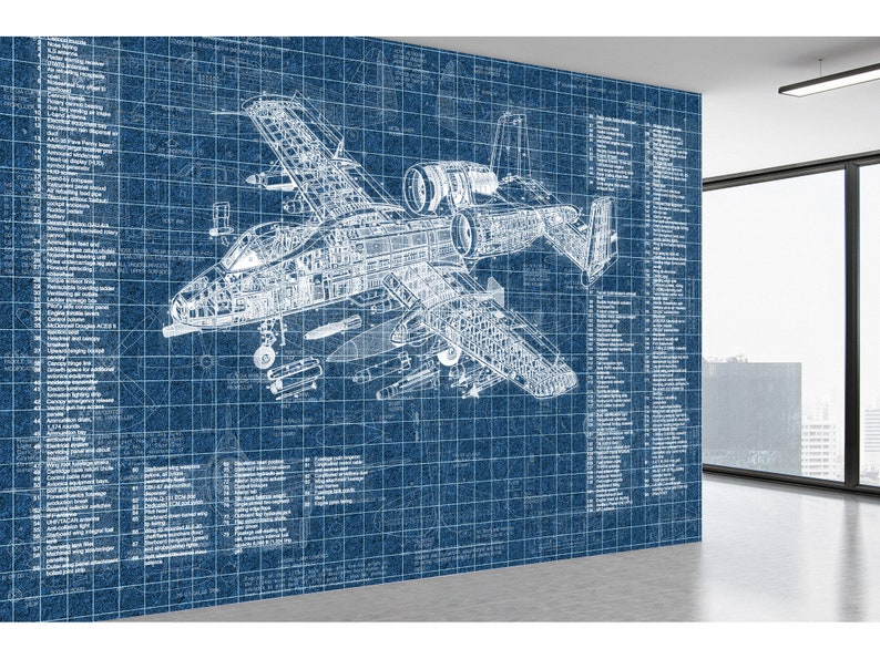 May include: A large wall mural featuring a detailed white technical blueprint of an A-10 Thunderbolt II aircraft on a blue grid background. The design includes extensive technical annotations and numbered labels detailing various aircraft components.