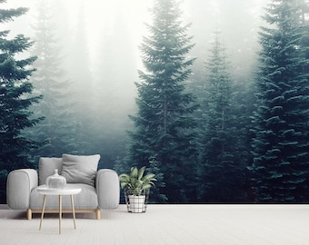 Pode incluir: Uma cena interior serena com uma poltrona cinza, uma pequena mesa lateral branca e uma planta em vaso. O fundo é um mural de floresta com árvores verdes altas na névoa, criando um ambiente tranquilo e natural. O quarto tem um design minimalista.