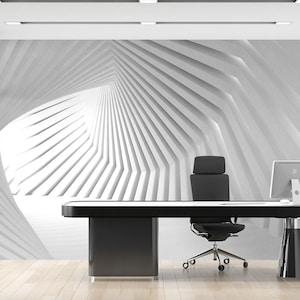 Puede incluir: Oficina moderna con escritorio negro, silla y ordenador frente a una pared geométrica blanca. La habitación tiene suelo de madera clara y una pared de cristal, creando una estética minimalista. El escritorio mide unos 200 cm de largo.