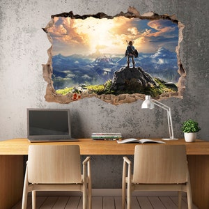 May include: A wall decal featuring a video game character standing on a mountaintop overlooking a vast landscape. The decal is designed to look like a hole in the wall, creating a 3D effect.