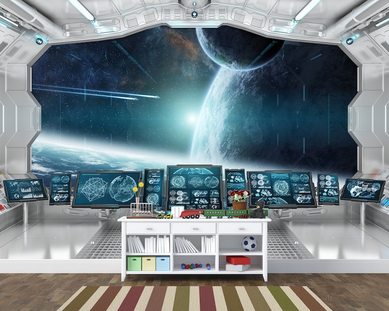 May include: A futuristic interior scene with a large window overlooking a space scene with planets and stars. A white cabinet holds toys, books, and a soccer ball. Multiple computer screens display data. The room has a metallic, modern design.