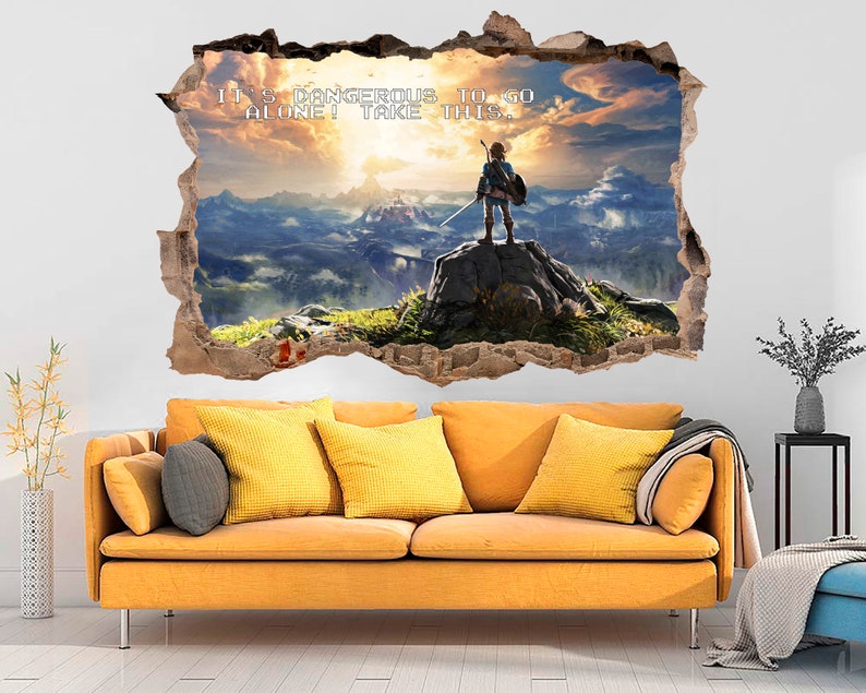May include: A wall decal featuring a video game character standing on a cliff overlooking a mountain range. The decal is designed to look like a hole in the wall, with the character and scenery appearing to be behind the wall. The text "It's dangerous to go alone! Take this." is written in white letters on the decal.