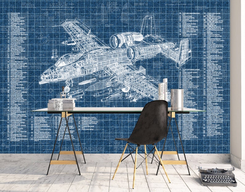 May include: A blue wallpaper mural featuring a white technical blueprint of an A-10 Thunderbolt II aircraft with detailed numbered parts lists on both sides. The design includes a grid pattern overlay and technical annotations throughout the image.