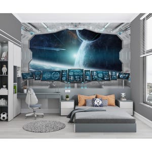 May include: A bedroom with a space-themed mural. The mural depicts a futuristic spaceship interior with a view of planets and stars. The room includes a bed, desk, chair, and a round rug. The color scheme is primarily gray and blue.