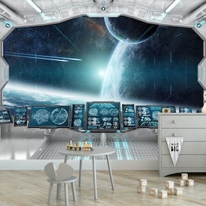 May include: A child's room with a space theme. The room features a large window with a view of planets and stars. There are computer screens, a small table, a chair, a dresser, and a bunny-shaped lamp. A banner reads "Dream Big".