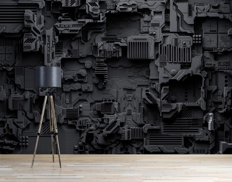 May include: A dark gray, textured wall with a complex, mechanical design. A wooden tripod floor lamp with a dark gray lampshade stands in front of the wall. The floor is light-colored wood.