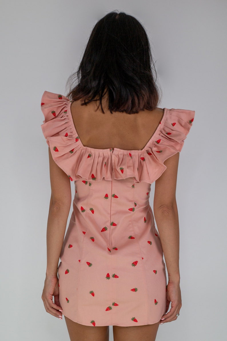 Mirabelle strawberry print peach mini dress with statement frill neck