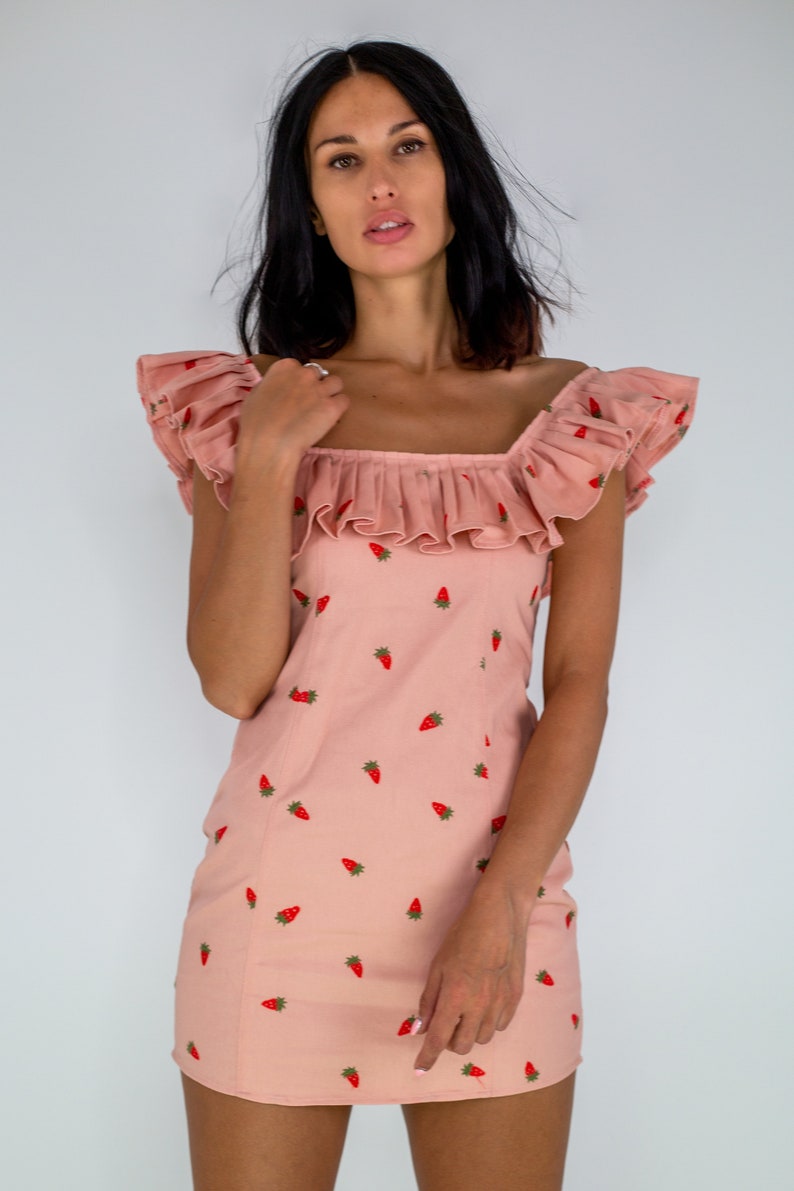 Mirabelle strawberry print peach mini dress with statement frill neck