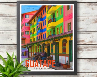 May include: A colorful street scene in Guatape, Colombia. The buildings are painted in bright colors, including yellow, green, blue, red, and pink. There are people sitting at tables outside a cafe.