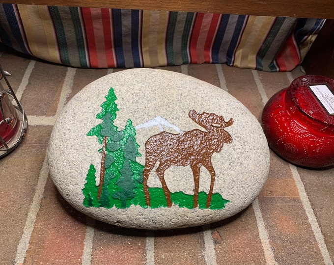 Moose and mountain Colorado river stone - Colorado River Stone engraved with a moose, trees and mountain and painted  brown, green and white