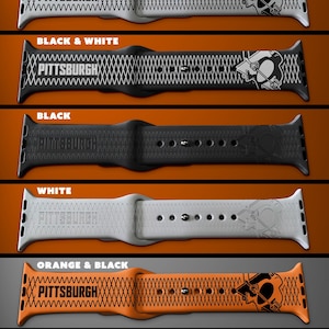 May include: Five different Apple Watch bands with a Pittsburgh Pirates logo and a diamond pattern. The bands are white and black, black and white, black, white, and orange and black.