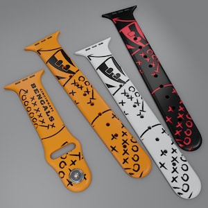 May include: Three silicone watch bands featuring football play diagrams. One orange band displays the text CINCINNATI BENGALS with black X and O markings. A second orange band and a white band feature black markings, while a black band has red markings.