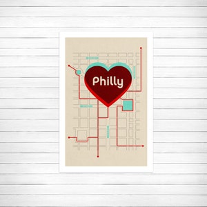 May include: A red heart with the word "Philly" inside, on a beige background with a stylized city map in black and blue.