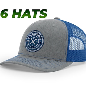May include: A gray and blue trucker hat with a blue logo that says "QuickScrews International Corporation" and a crossed screwdriver design.