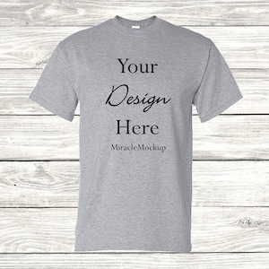 May include: A gray t-shirt mockup with the text "Your Design Here" and "MiracleMockup" printed on the front.
