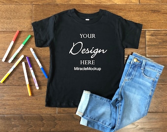Kids Black Bella Canvas Mock up Toddler 3001T T-Shirt Toddler Shirts Wood Background Markers Jeans Children Flat Lay Mockup Template sd4