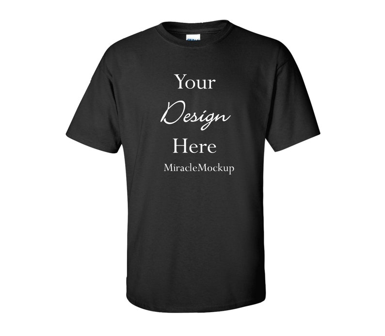 May include: A black short-sleeved t-shirt featuring white printed text on the chest that reads Your Design Here and MiracleMockup. The garment has a crew neckline and a standard fit, presented as a blank template for custom graphic placement.