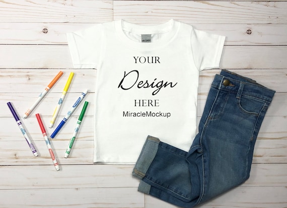 Kids White Gildan Mock up Toddler T-shirt Toddler Markers Jeans Shirts  White Wood Background Flat Lay Mockup Design Template Mv2 