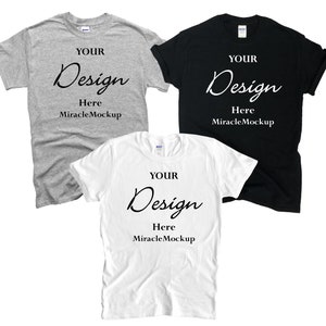 May include: Three t-shirts in different colors: gray, white, and black. Each shirt has the text "YOUR Design Here MiracleMockup" printed on the front.