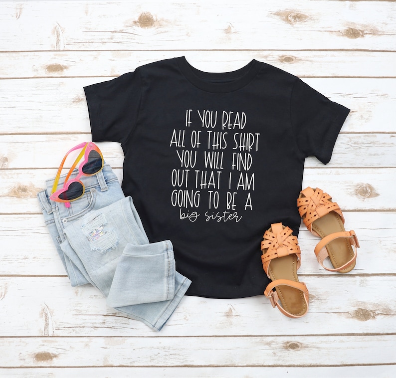 Puede incluir: Camiseta negra con texto blanco que dice "Si lees toda esta camiseta, descubrir&aacute;s que voy a ser una hermana mayor."