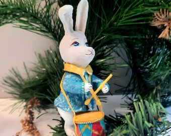 Handmade cotton Christmas tree ornament in the shape of a bunny. Hanging drumming bunny.
