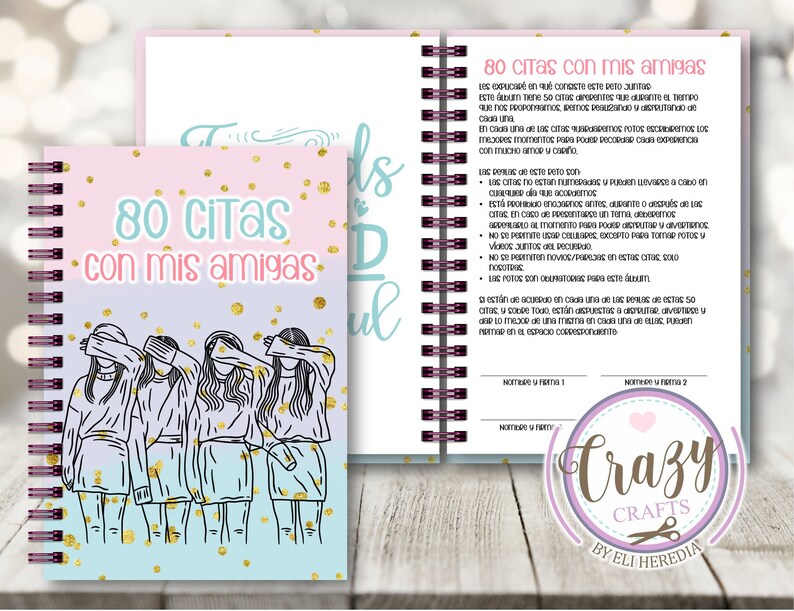 May include: A pink and blue notebook with a gold glitter design and a drawing of four friends with their eyes covered. The notebook has a spiral binding and the text "80 Citas con mis amigas" on the cover.