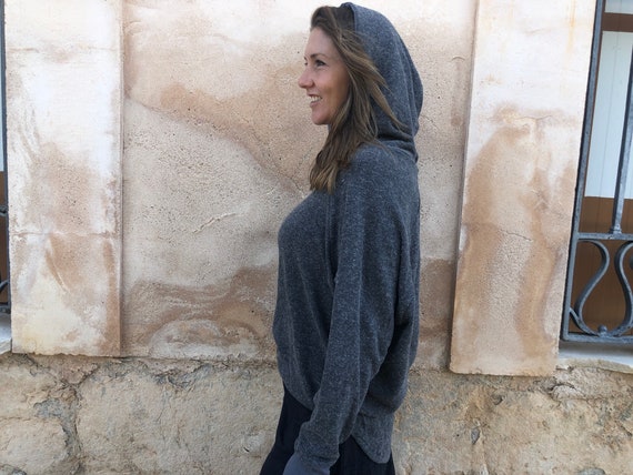 Knitted sweater with printed hood