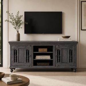 May include: A dark gray wooden media console featuring two side cabinets with decorative vertical spindle accents and a central open shelving unit with three levels. The console has a rectangular top, a molded edge, and turned feet.