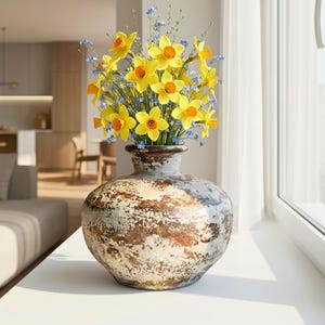 May include: A white ceramic mug with a black handle and the text "But First, Coffee" in a bold, black font. The mug is displayed on a white surface, showcasing its clean design.