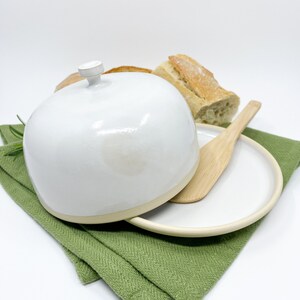 White medium-sized pottery butter dish with lid in modern style.