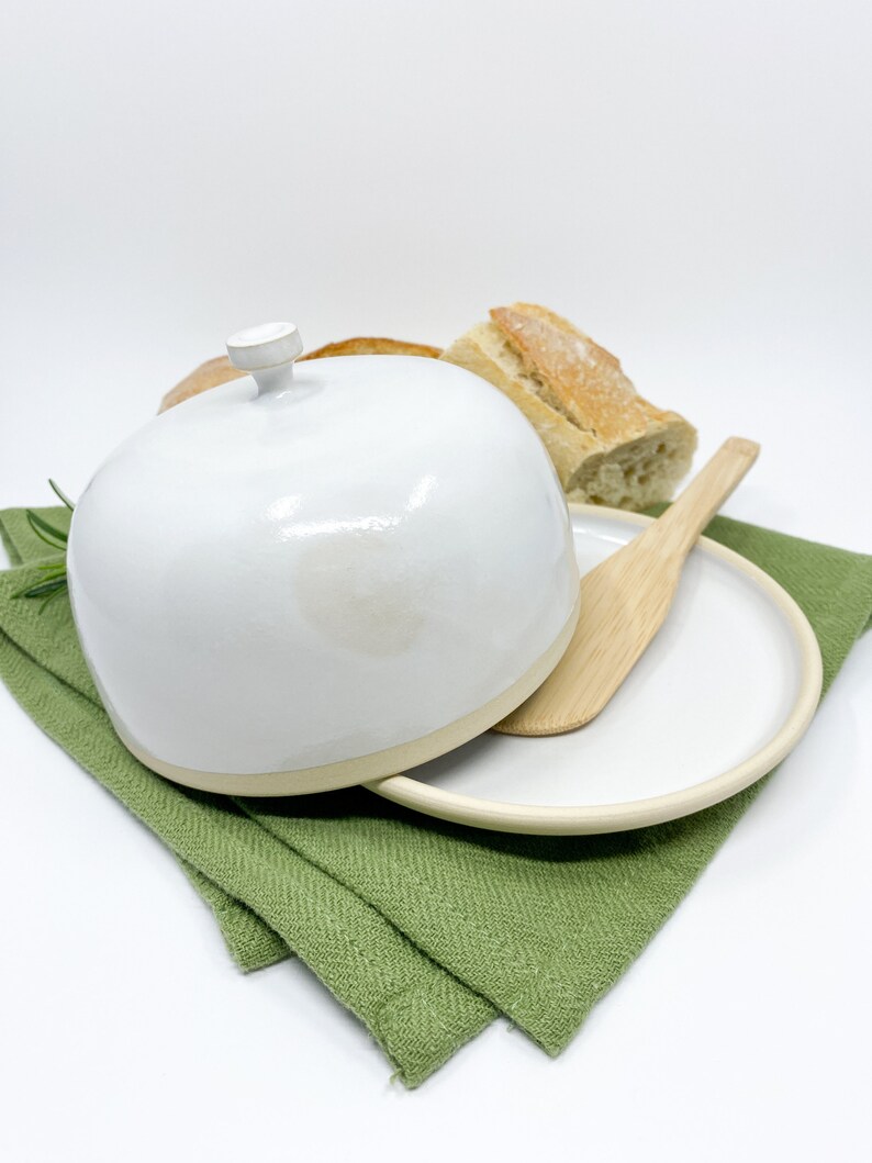 White medium-sized pottery butter dish with lid in modern style.