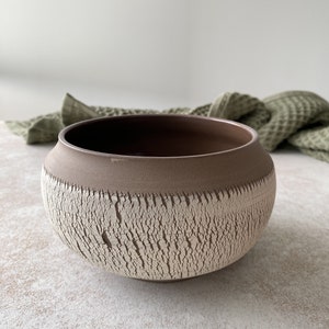 Medium handmade pottery bowl in boho style.