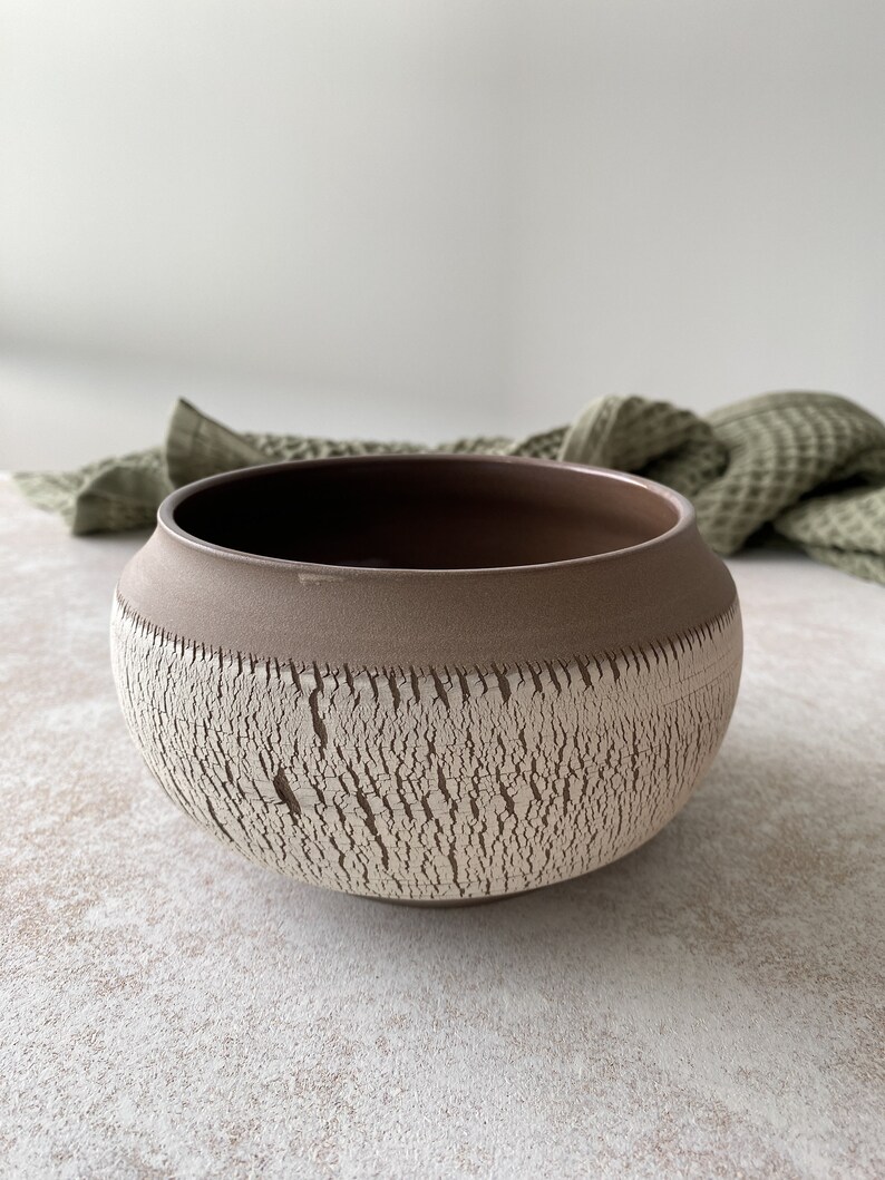 Medium handmade pottery bowl in boho style.