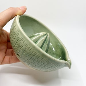 green handmade pottery lemon squeezer for modern kitchen