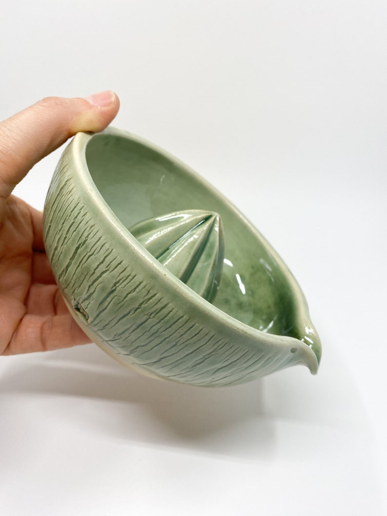 green handmade pottery lemon squeezer for modern kitchen