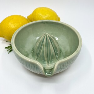 green handmade stoneware ceramic lemon squeezer for modern kitchen