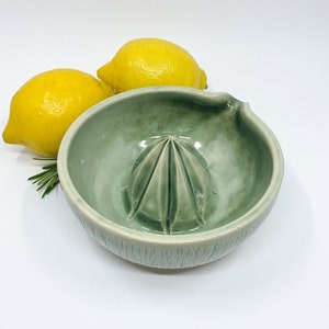 green handmade pottery lemon juicer for modern kitchen