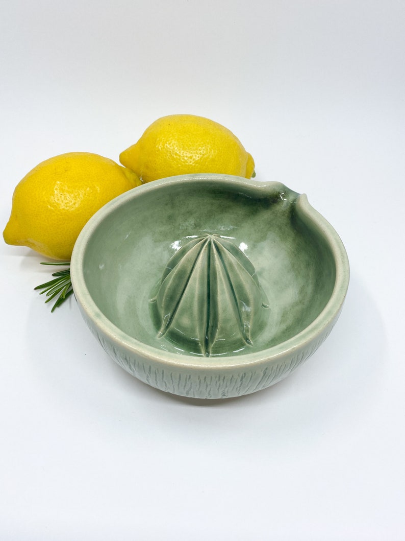 green handmade pottery lemon juicer for modern kitchen