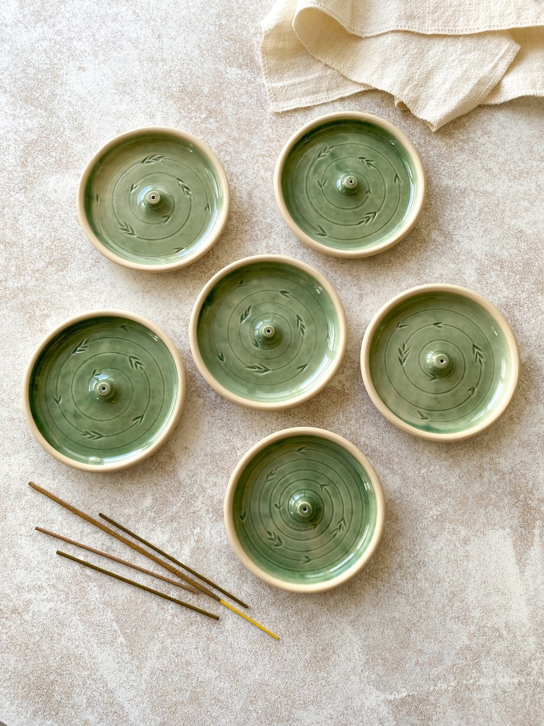 Green round pottery incense holders.