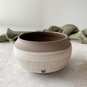 Medium handmade stoneware ceramic bowl in boho style.