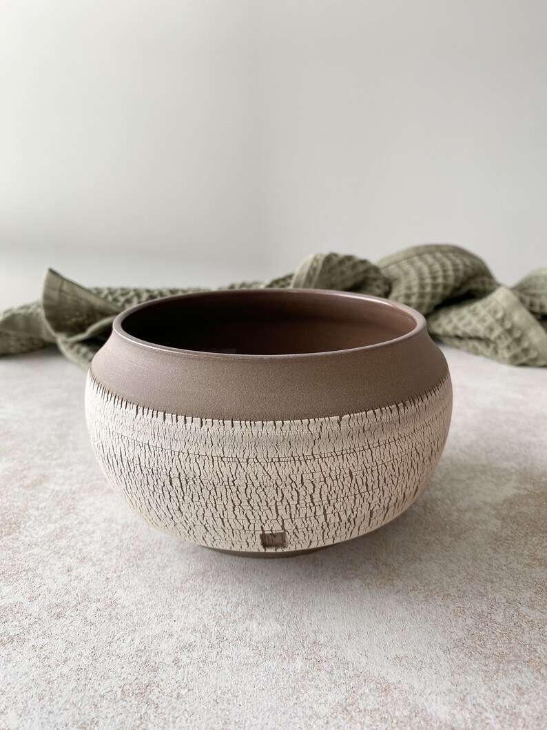 Medium handmade stoneware ceramic bowl in boho style.