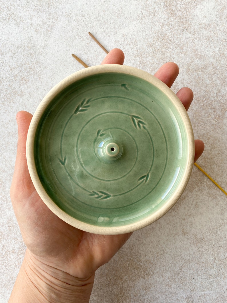 Green round ceramic incense burner.