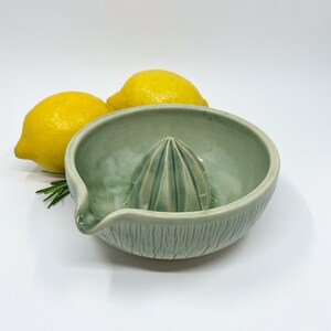 green handmade pottery lemon squeezer for minimalist kitchen