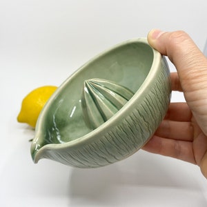 green handmade ceramic lemon squeezer for minimalist kitchen