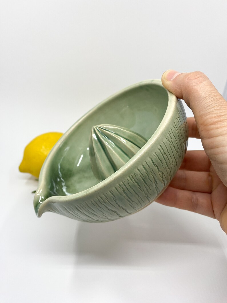 green handmade ceramic lemon squeezer for minimalist kitchen