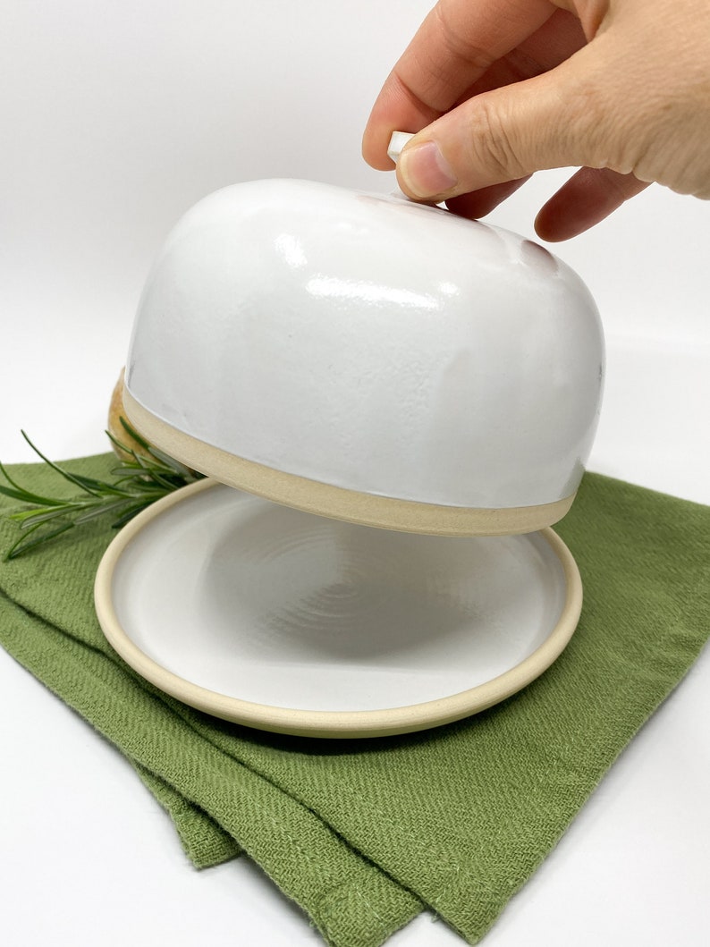 White medium-sized stoneware ceramic butter dish with lid in modern style.